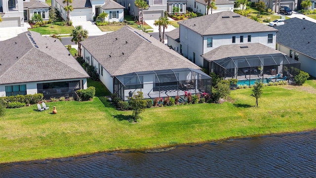 aerial view with a residential view and a water view