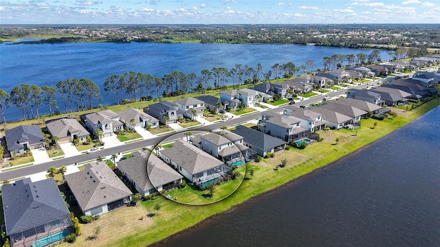 aerial view with a residential view and a water view