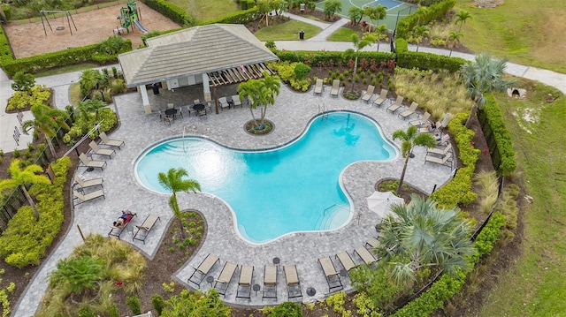 community pool with a patio area