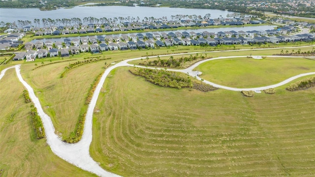 birds eye view of property featuring a water view and a residential view