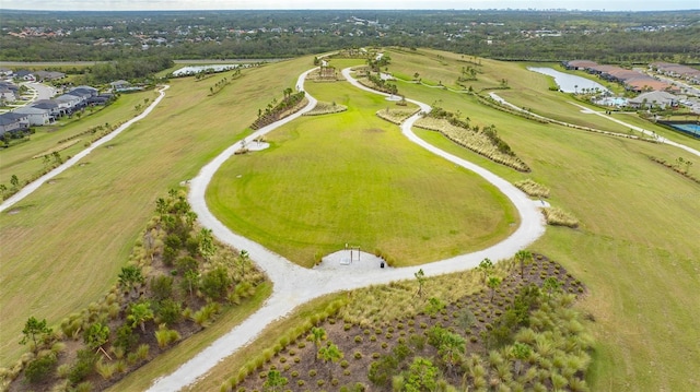 birds eye view of property featuring a water view and a rural view