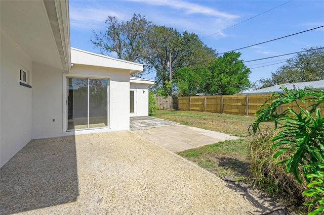 view of yard with a patio area and a fenced backyard