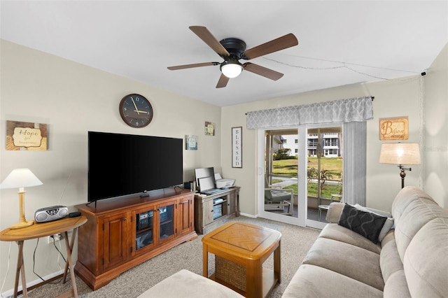 living room with ceiling fan, carpet, and baseboards