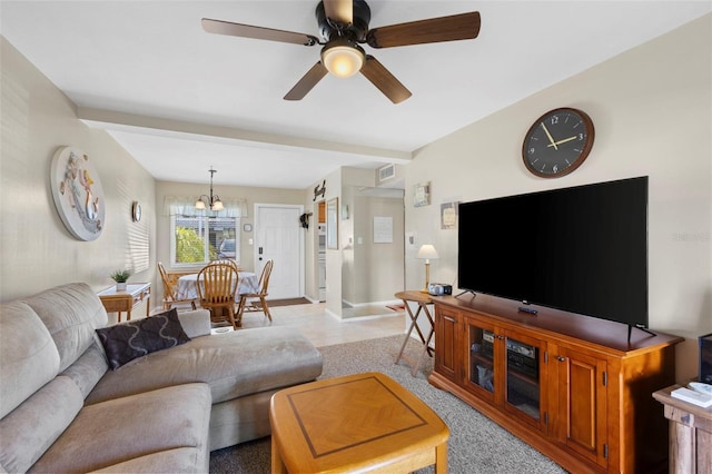 living room featuring visible vents, ceiling fan, and baseboards