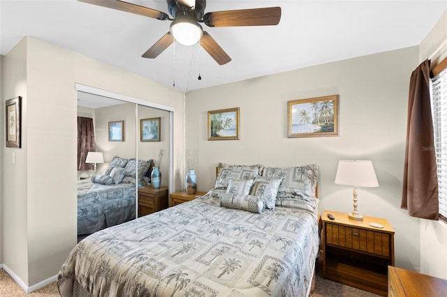 carpeted bedroom featuring ceiling fan, baseboards, and a closet