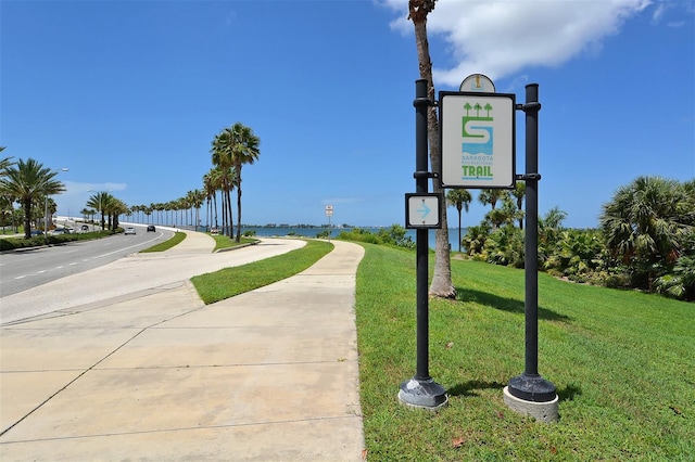 view of property's community with a yard