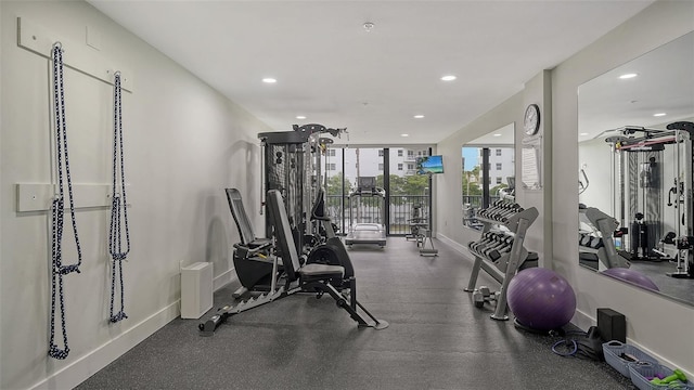 gym featuring baseboards and recessed lighting