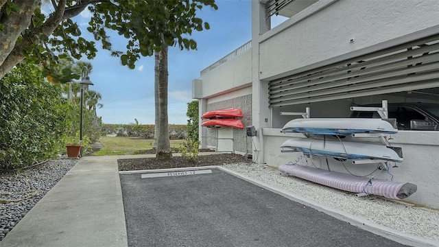 exterior space with parking and stucco siding