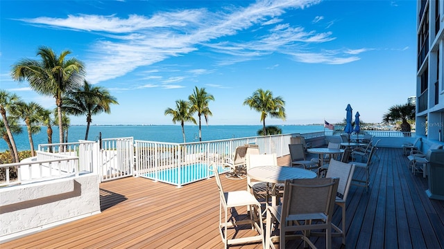 wooden deck featuring a water view