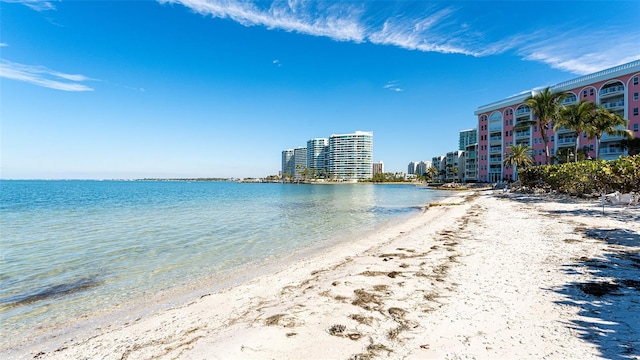 property view of water featuring a beach view and a city view