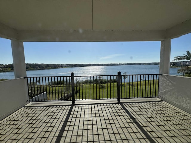 wooden terrace with a water view