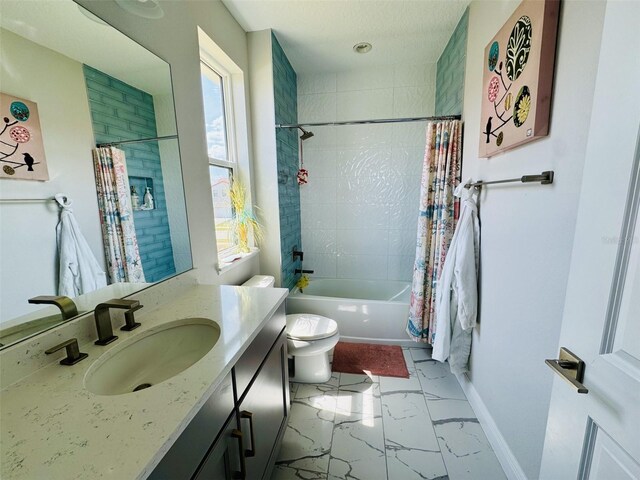 16832 Bolsena Dr, Bella Collina, FL 34756 - bathroom featuring marble look tile flooring, toilet, shower / tub combo with curtain, vanity, and baseboards