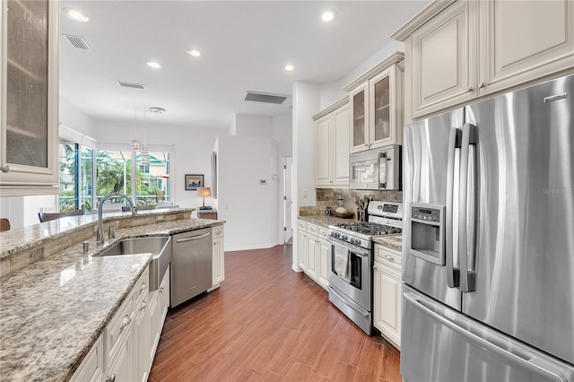 kitchen with visible vents, appliances with stainless steel finishes, and a sink