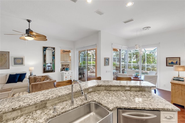 kitchen with a healthy amount of sunlight, visible vents, and a sink