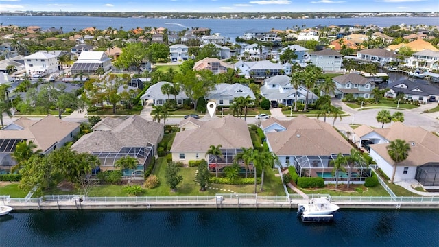 aerial view featuring a residential view and a water view