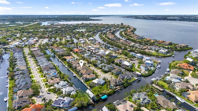 aerial view with a residential view and a water view