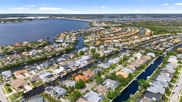 birds eye view of property with a residential view and a water view