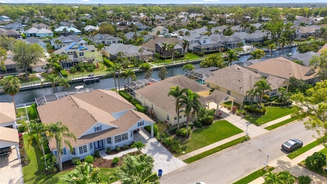 aerial view featuring a residential view and a water view