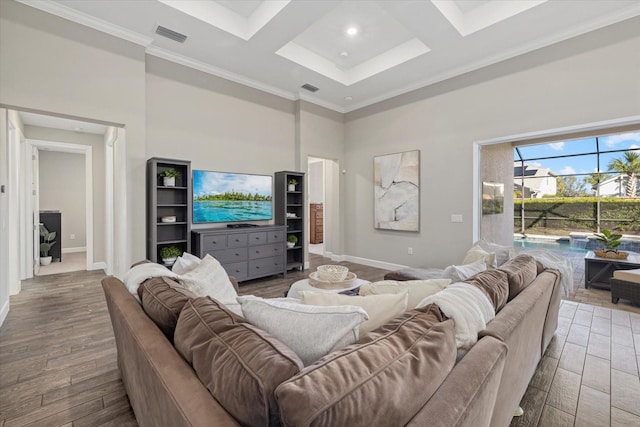 living room featuring coffered ceiling, wood finished floors, a towering ceiling, and baseboards