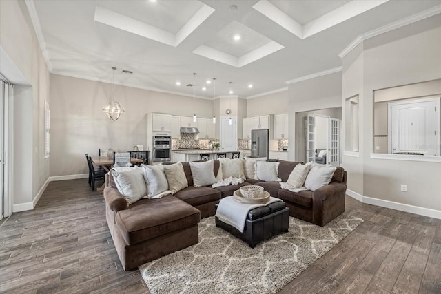 living area featuring dark wood-type flooring, coffered ceiling, baseboards, and an inviting chandelier