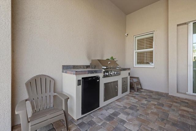 view of patio with a grill and area for grilling