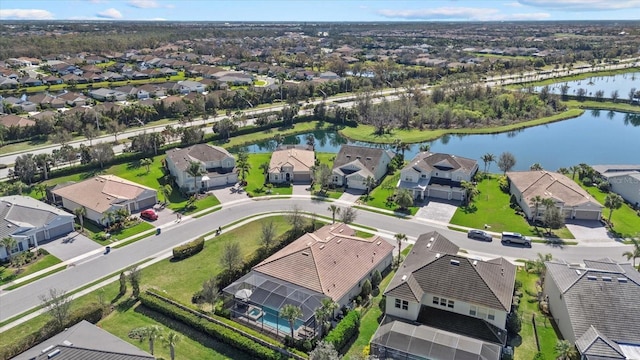 aerial view featuring a water view and a residential view