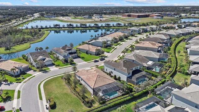 birds eye view of property featuring a residential view and a water view