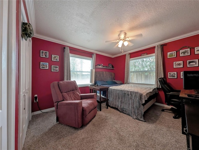 32 Fallen Oak Ln, Palm Coast, FL 32137 - bedroom with an office area, ornamental molding, carpet flooring, a textured ceiling, and ceiling fan