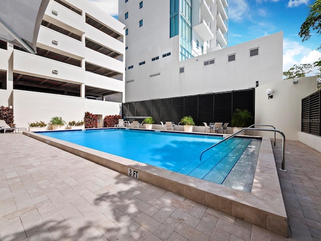 community pool featuring a patio