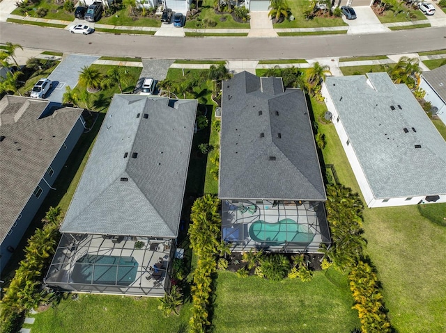 birds eye view of property with a residential view