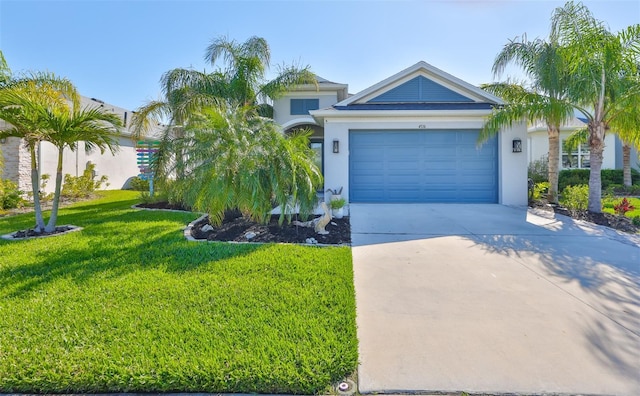 view of front of house with a garage, a front lawn, concrete driveway, and stucco siding