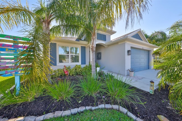 4516 Renwick Dr, Parrish, FL 34219 - view of front of property with stucco siding, a garage, and driveway