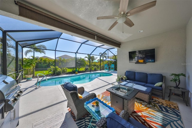 4516 Renwick Dr, Parrish, FL 34219 - outdoor pool with an outdoor living space with a fire pit, a patio, a ceiling fan, area for grilling, and a lanai