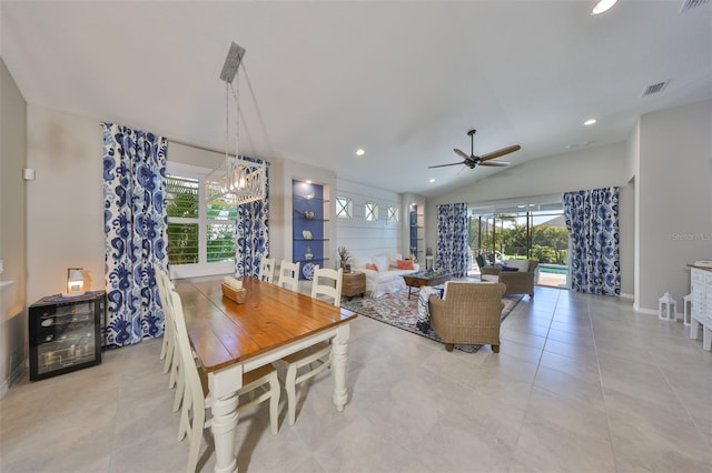4516 Renwick Dr, Parrish, FL 34219 - dining room with lofted ceiling, ceiling fan, recessed lighting, light tile patterned floors, and a chandelier