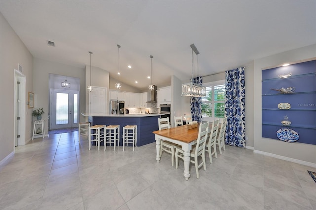 4516 Renwick Dr, Parrish, FL 34219 - dining room featuring vaulted ceiling, light tile patterned flooring, and recessed lighting