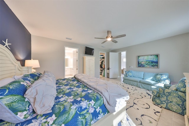 4516 Renwick Dr, Parrish, FL 34219 - tiled bedroom featuring a walk in closet, connected bathroom, and a ceiling fan