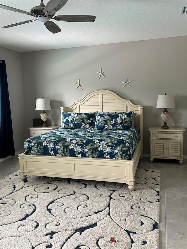4516 Renwick Dr, Parrish, FL 34219 - bedroom with light tile patterned floors and a ceiling fan