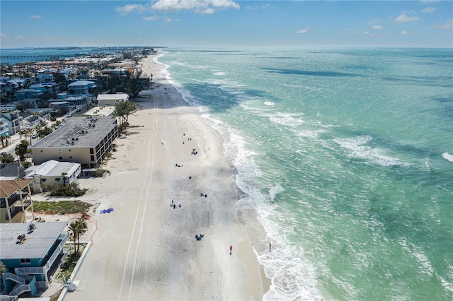 drone / aerial view featuring a water view and a beach view