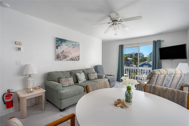 living area with a ceiling fan