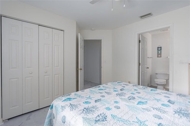 bedroom with marble finish floor, a closet, visible vents, ensuite bathroom, and a ceiling fan