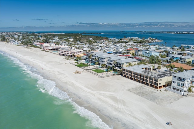 bird's eye view featuring a water view and a view of the beach