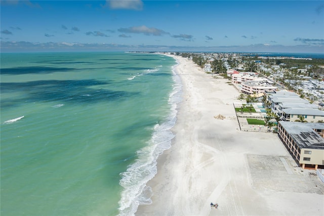 drone / aerial view featuring a water view and a view of the beach