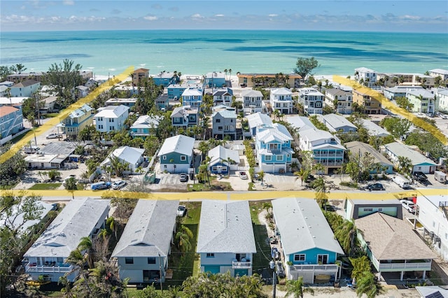 birds eye view of property with a water view and a residential view