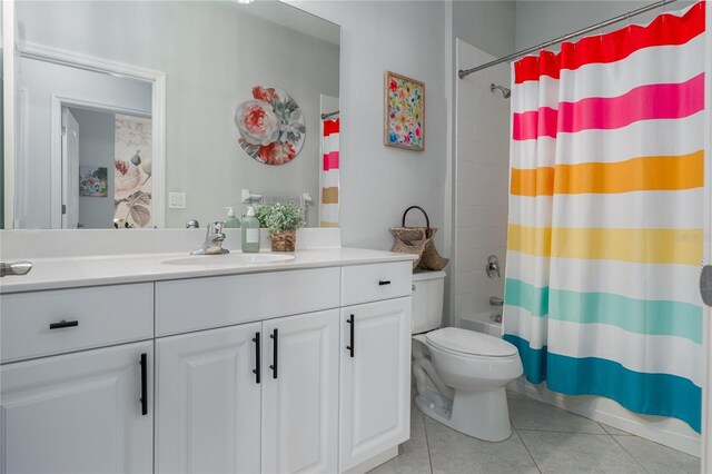 full bathroom with shower / tub combo with curtain, toilet, vanity, and tile patterned flooring