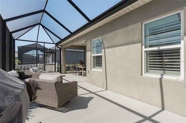 view of patio / terrace featuring outdoor lounge area and a lanai