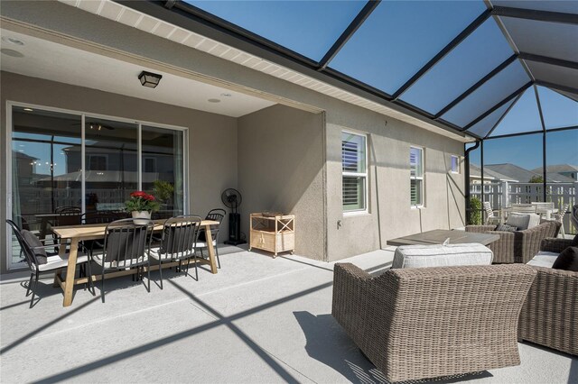 view of patio featuring a lanai and outdoor dining space