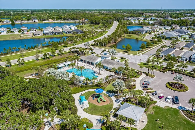 drone / aerial view featuring a water view and a residential view