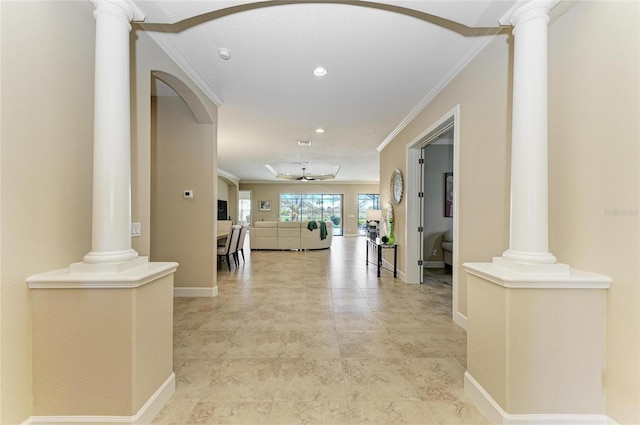 hallway featuring ornate columns, baseboards, crown molding, and recessed lighting