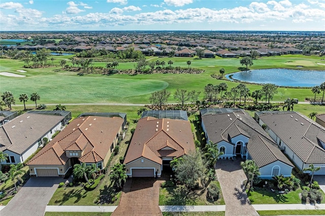 bird's eye view with a water view, a residential view, and golf course view