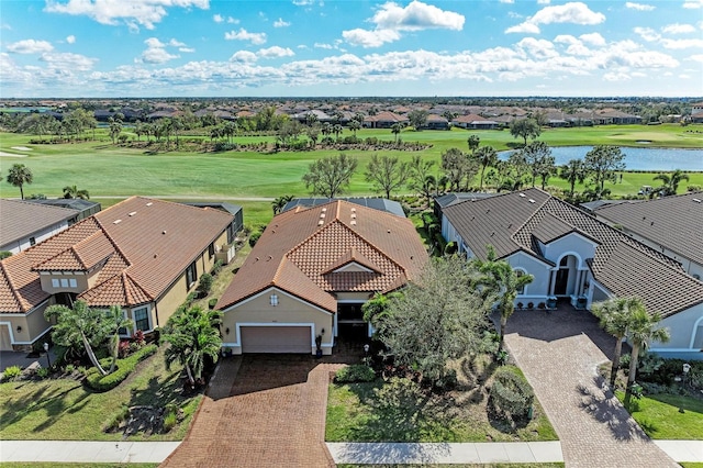 birds eye view of property featuring a residential view, a water view, and golf course view